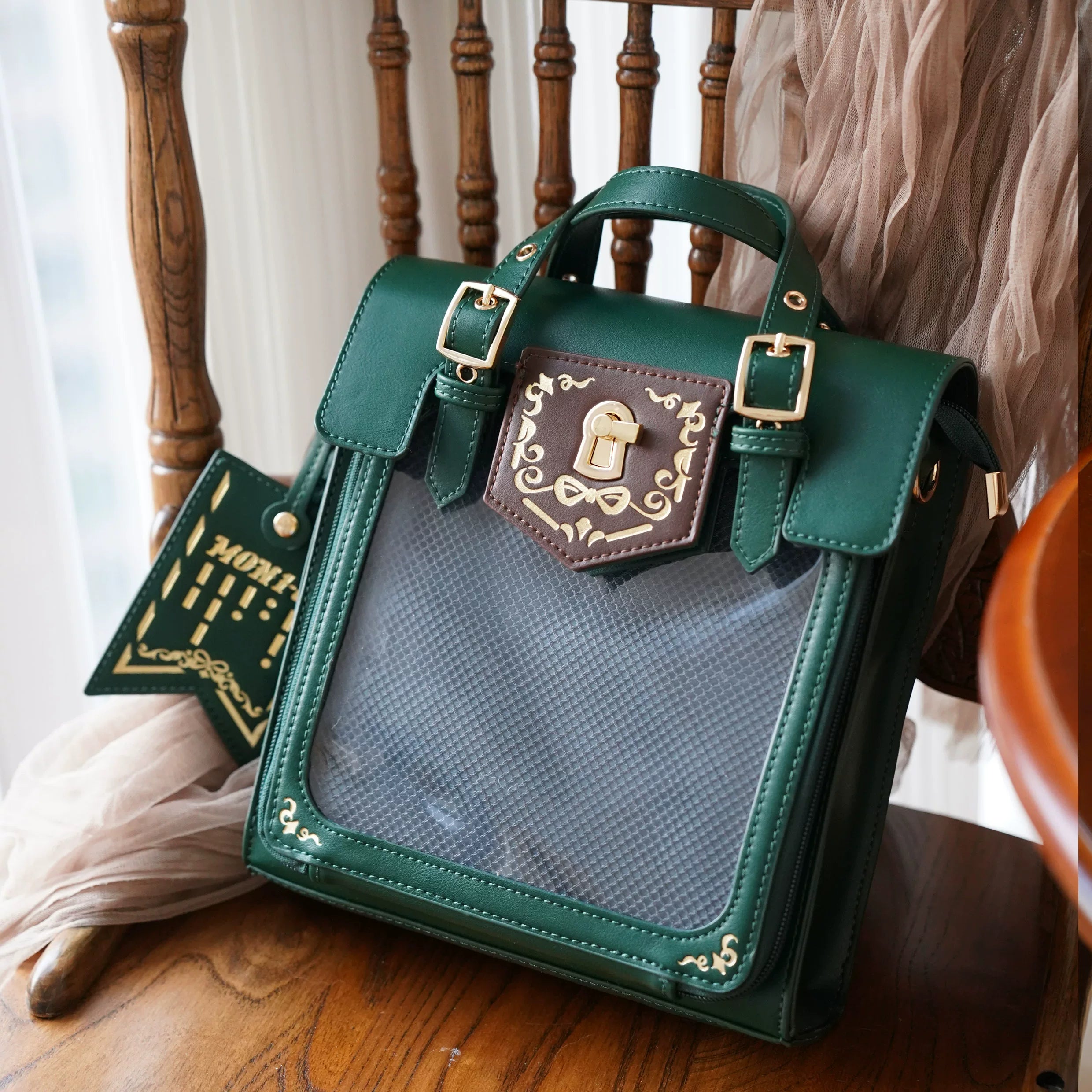 Green vintage Jirai Kei ita bag with unique emerald leather and clear display window filled with collectible anime pins and badges, standout colorway option
