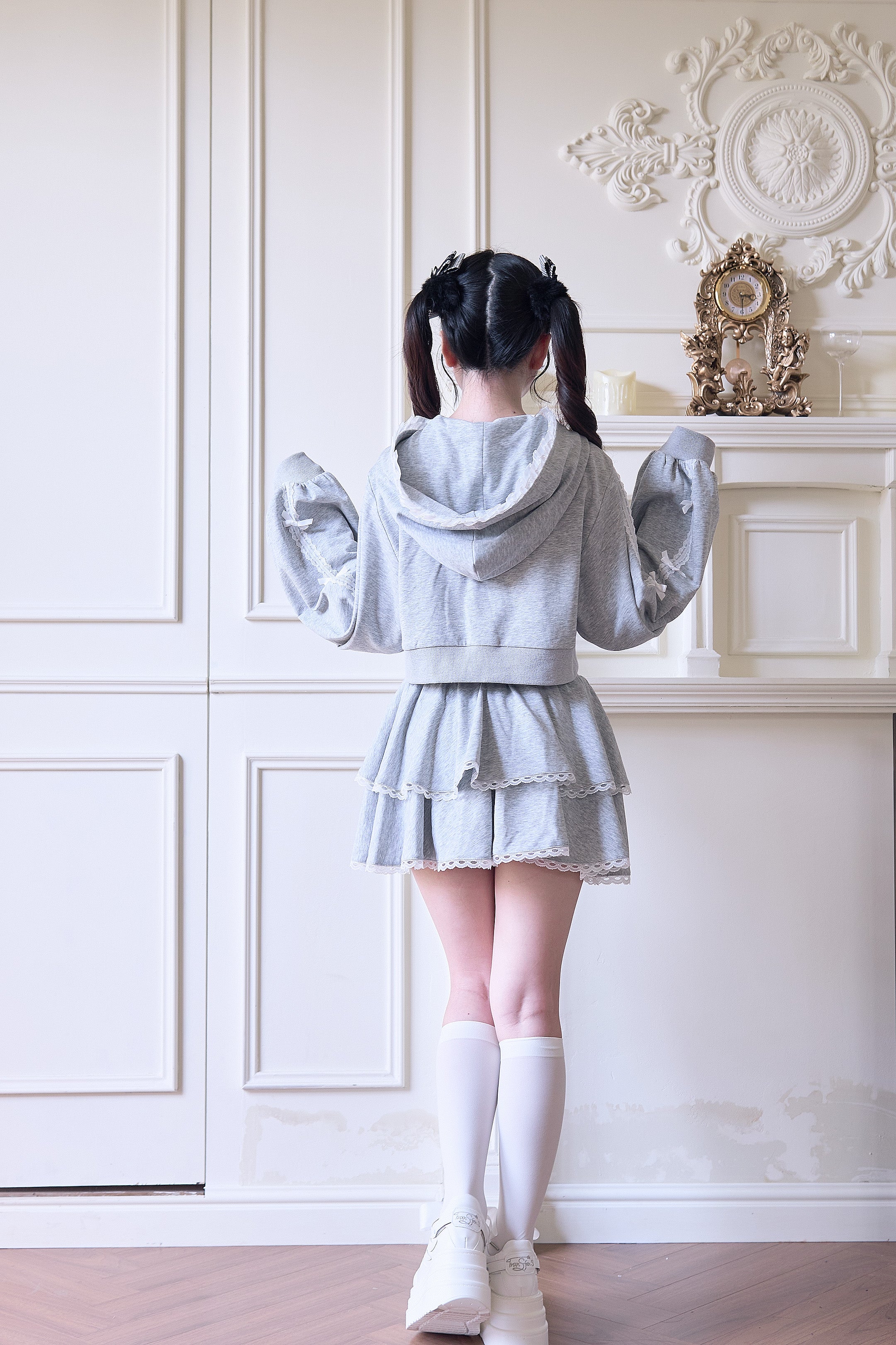 Gray Jirai Kei lace hoodie and tiered mini skirt back view showing hood design and layered skirt silhouette from behind