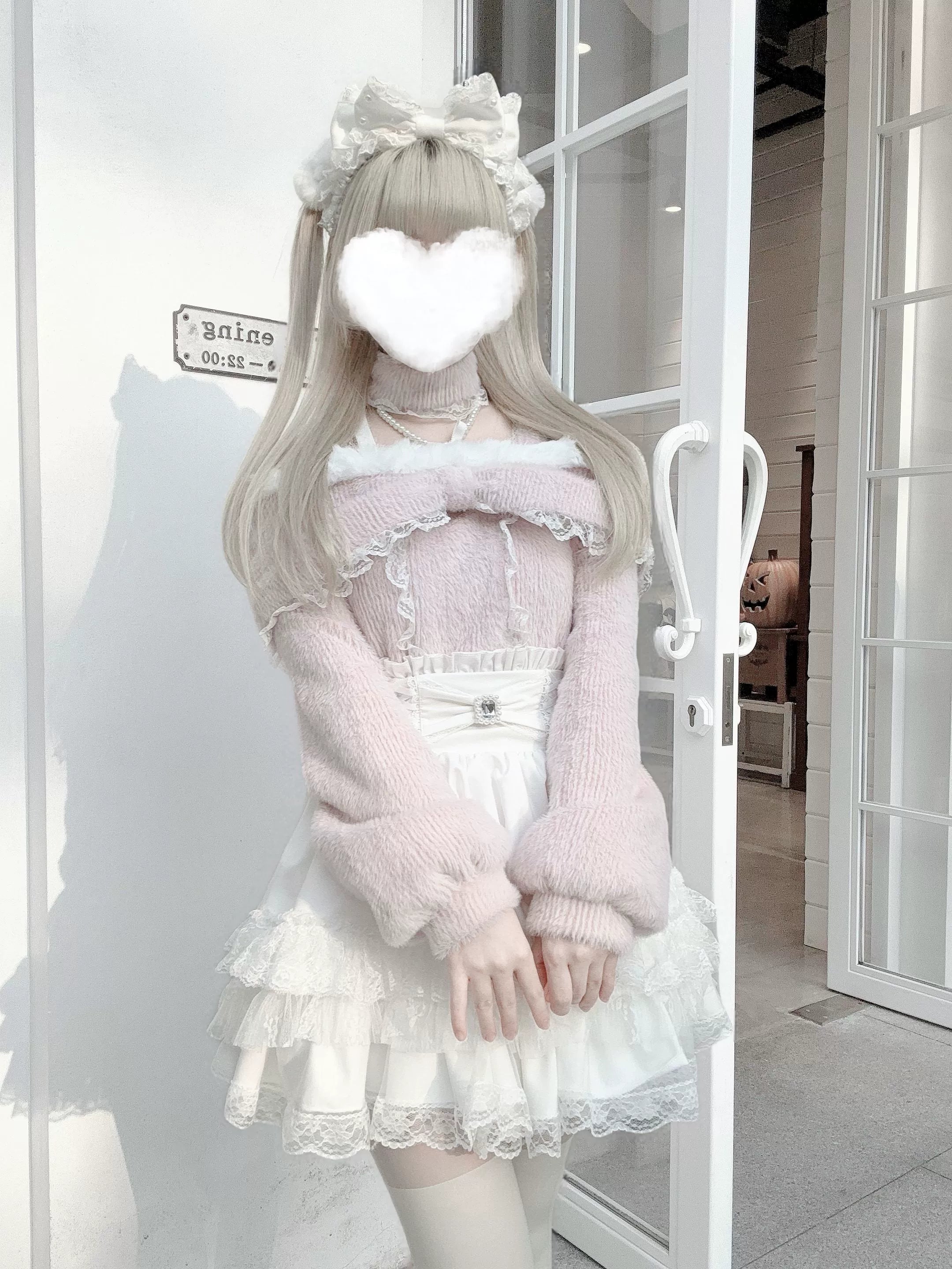 Close-up detail shot of plush fleece texture, ruffle trim, and oversized bow knot on off-shoulder top, highlighting quality craftsmanship