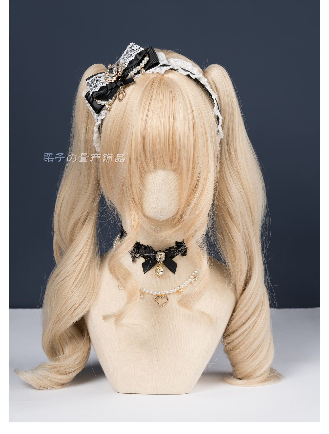 Black ryousangata lace bow headband with gold rhinestone trim full front view blonde mannequin matching black bow choker set jirai kei complete outfit