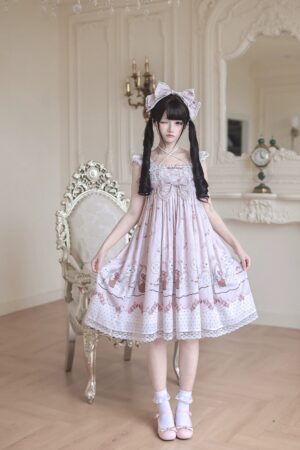 Strawberry bunny Jirai Kei Lolita dress front full-body view worn by model with twin-tails showing cross halter neckline detachable chest bow ruffled lace sleeves and plaid strawberry bunny print