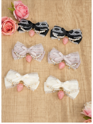 Jirai Kei lace bow hair clips collection flat lay five color options black gray pink blue cream red on wooden table with pink roses pearl chains strawberry charms