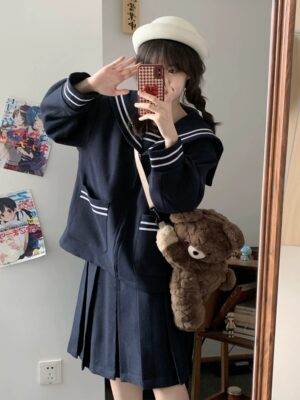 Navy sailor jk uniform set front mirror selfie view showing relaxed fit coat with white collar trim and pleated skirt indoor anime room aesthetic