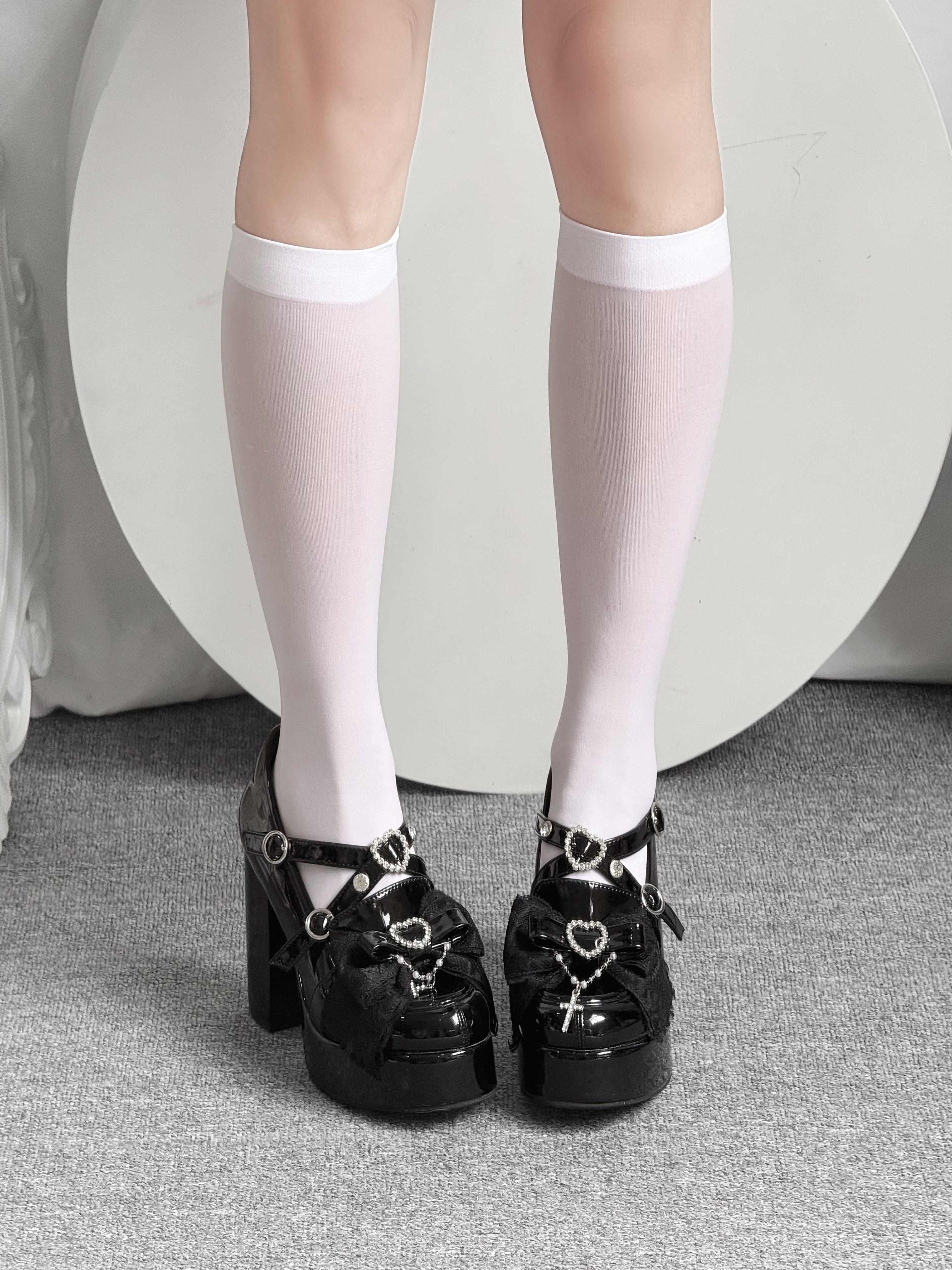 Jirai Kei calf socks solid color options white and black sheer knee-high leg wear collection display