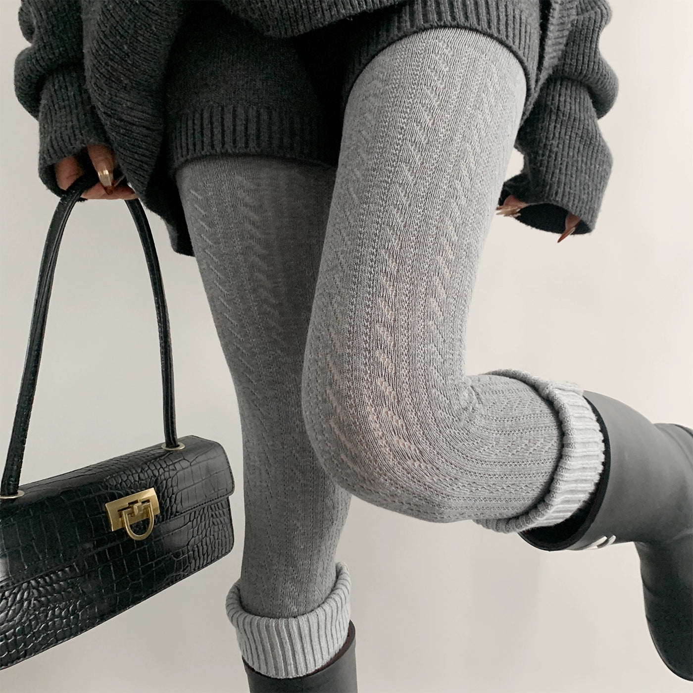 Light gray Jirai Kei hollow knit tights front side view twisted vertical texture with branded rain boots aesthetic