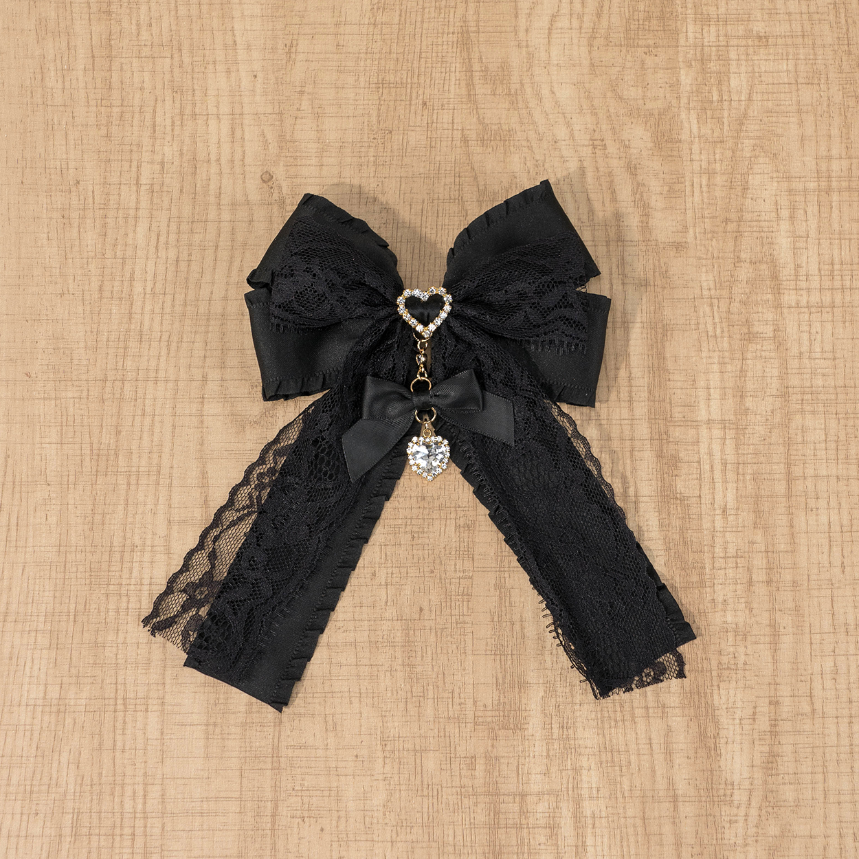 Black Jirai Kei lace bow brooch with elegant satin ribbon tails and lace trim detail, chest pin brooch accessory versatile styling