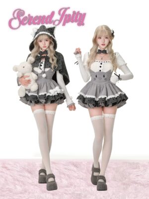 Two blonde models in matching Jirai Kei cat-eared hooded capes with polka dots, grey and white knit tops with lace trim, cat-face embroidered suspender skirts, wearing white thigh-high socks on furry pink rug, twin matching styling inspiration