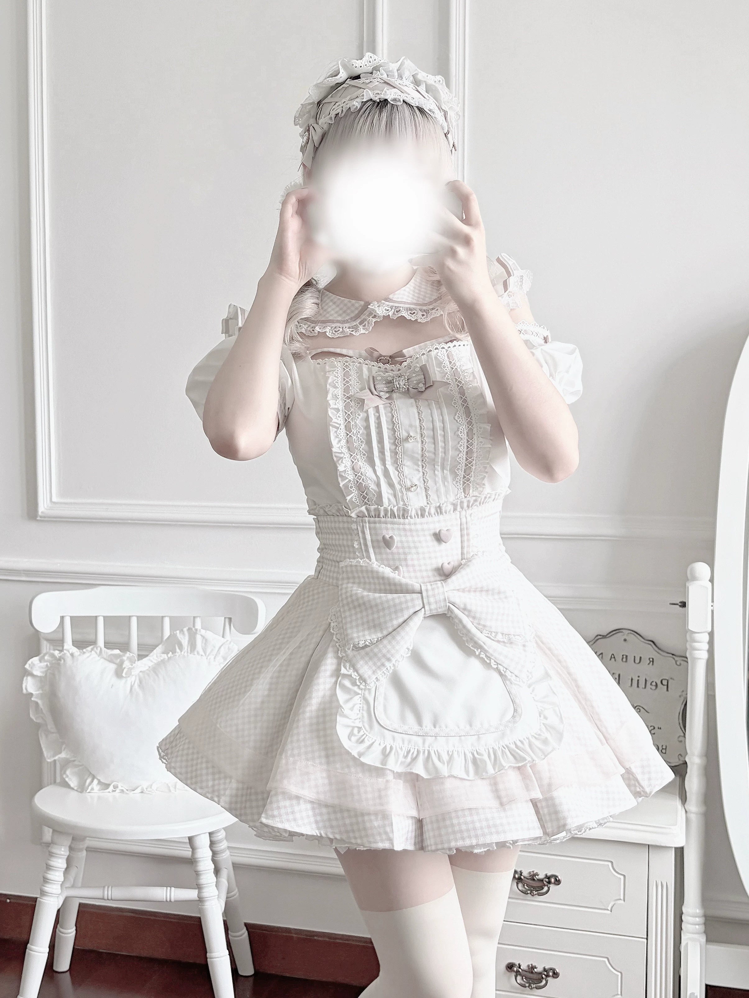 Detailed view of Jirai Kei maid skirt showing back elastic waist construction, adjustable side ties with bow accents, and gingham fabric pattern