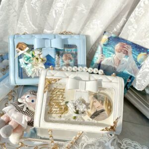 Dual kawaii jirai kei ita shoulder bags with rhombus quilting and removable bow in white and light blue pastels displayed on lace backdrop with anime posters