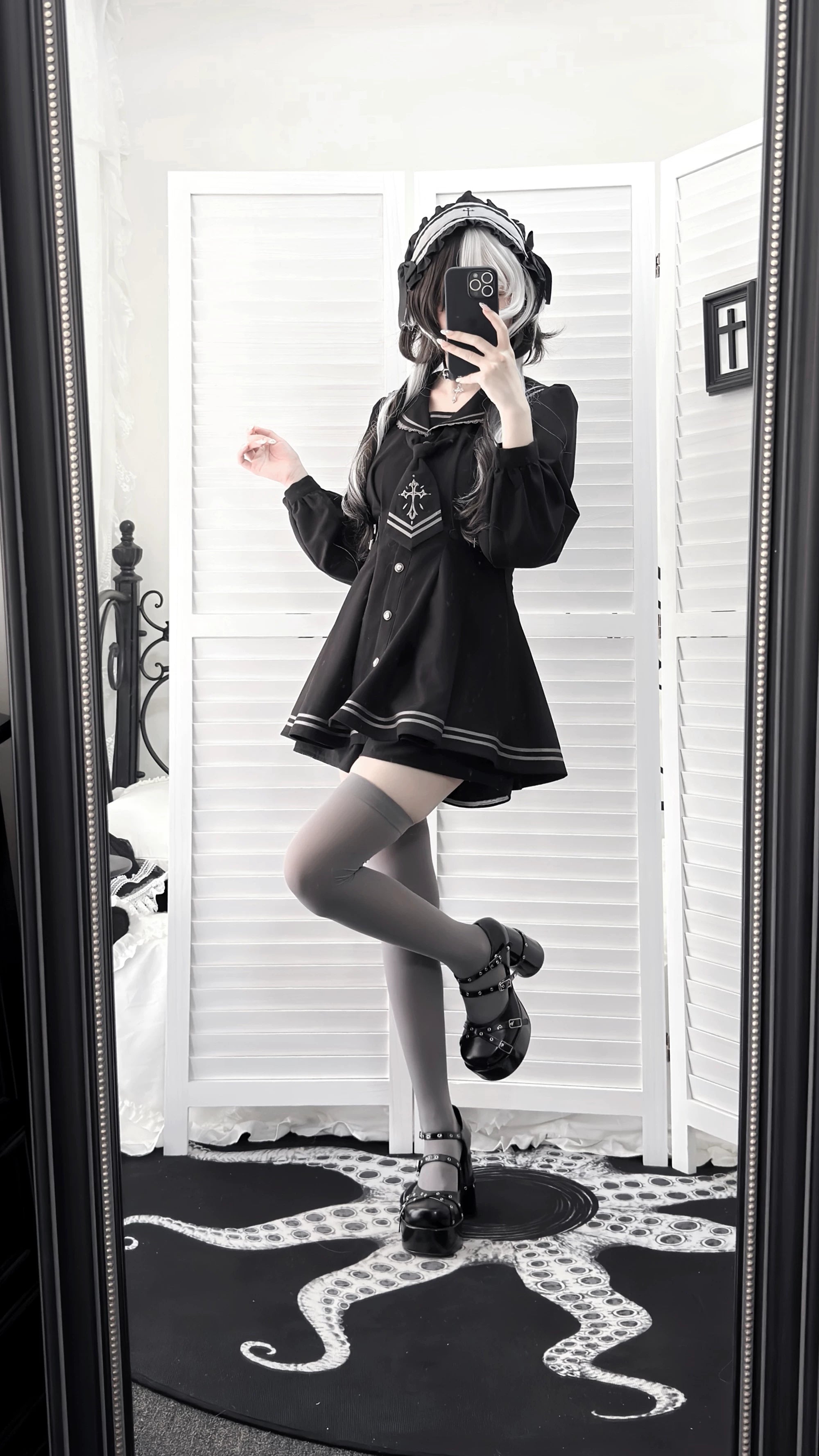 Detailed view of black sailor collar JK uniform blouse with lace sailor collar trim, cross embroidery, and lantern sleeve construction