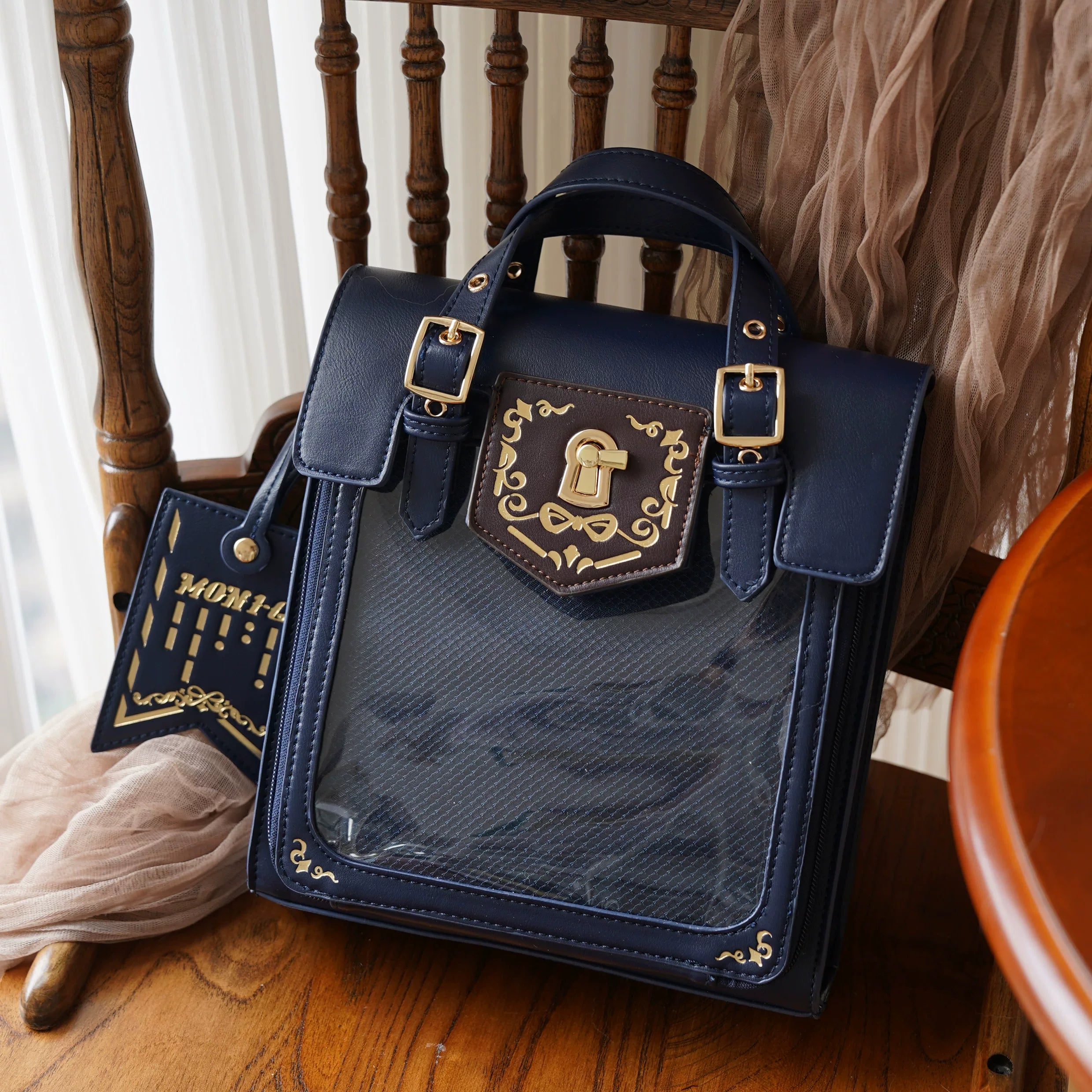 Dark blue vintage Jirai Kei ita satchel bag with deep moody leather tone and clear acrylic window featuring organized anime character collection display