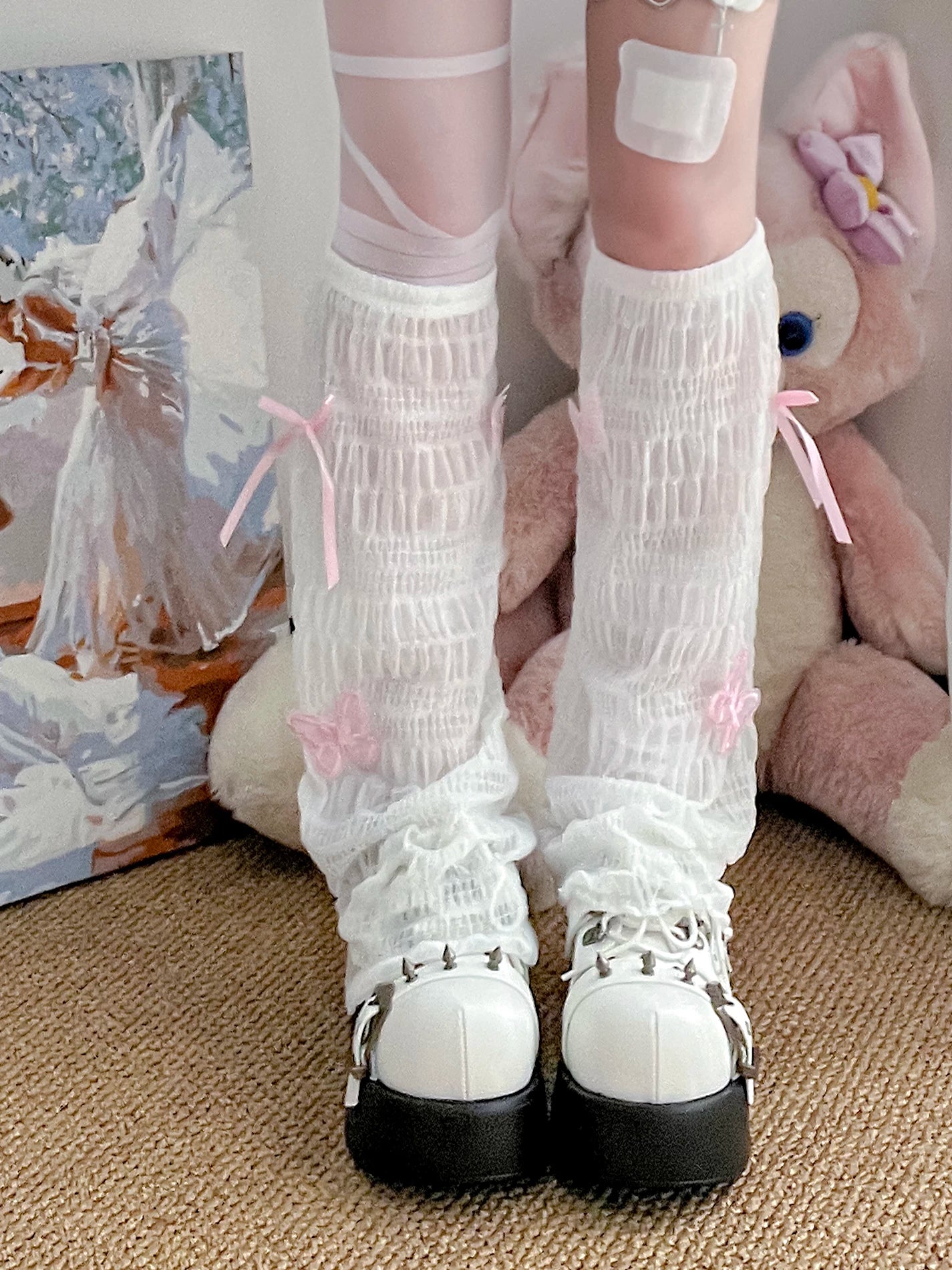 Close-up detail Jirai Kei mesh leg warmers white ruched pink bow flower decoration black platform shoes
