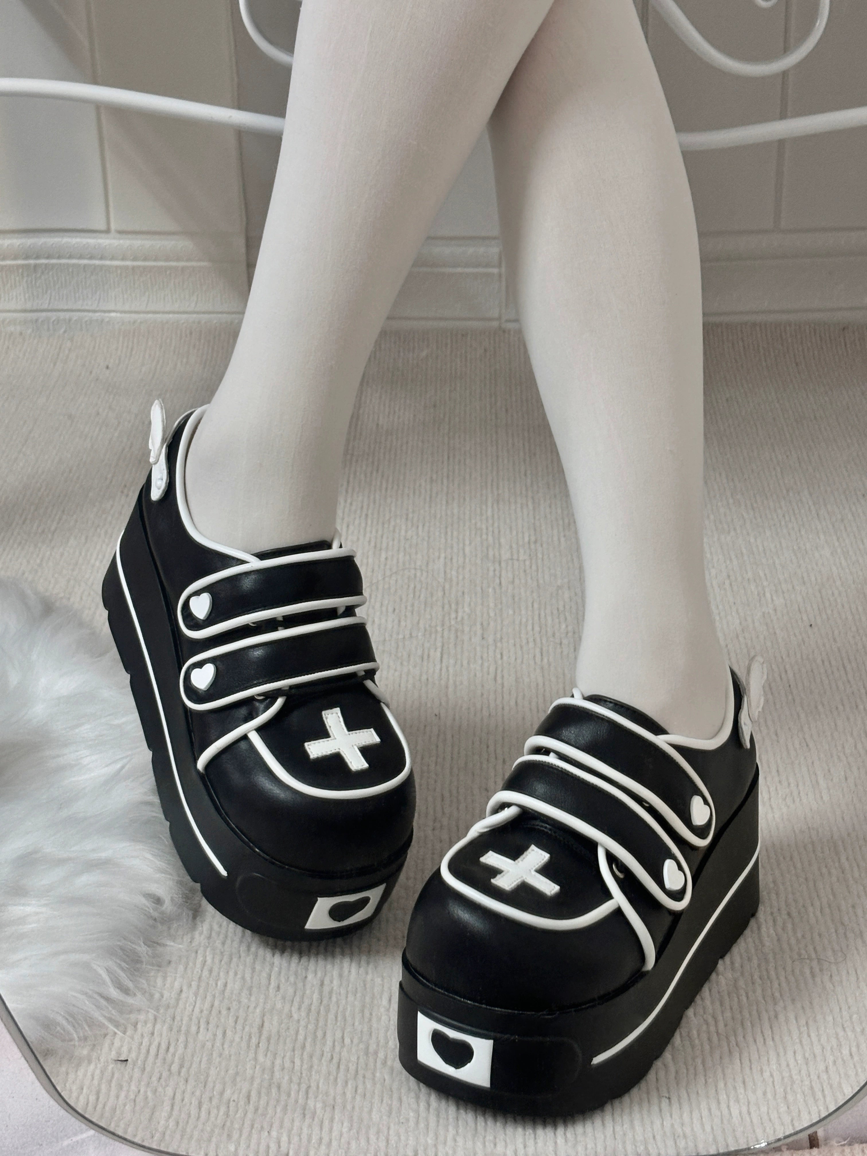 Angel heart platform shoes product showcase angled view thick chunky sole heart shaped heel cross accents