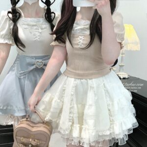 Pink Ryousangata puff sleeve blouse styled as complete two-piece Jirai Kei outfit with matching ruffled skirt, full body view featuring twin-tailed models with heart-shaped belt accessories and romantic aesthetic