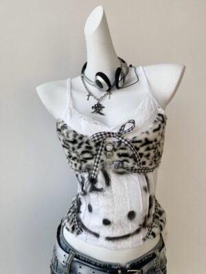 Y2K Jirai Kei leopard fuzzy cami top with gingham bow collar and smiley graphic print front three-quarter view on mannequin