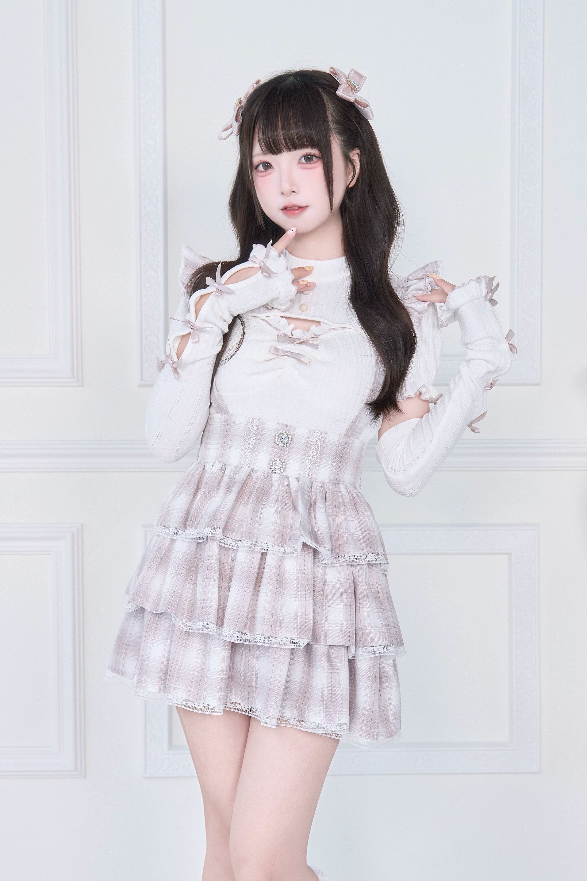 Pink plaid Jirai Kei two-piece set with white cutout knit top and layered skirt front view - subculture fashion