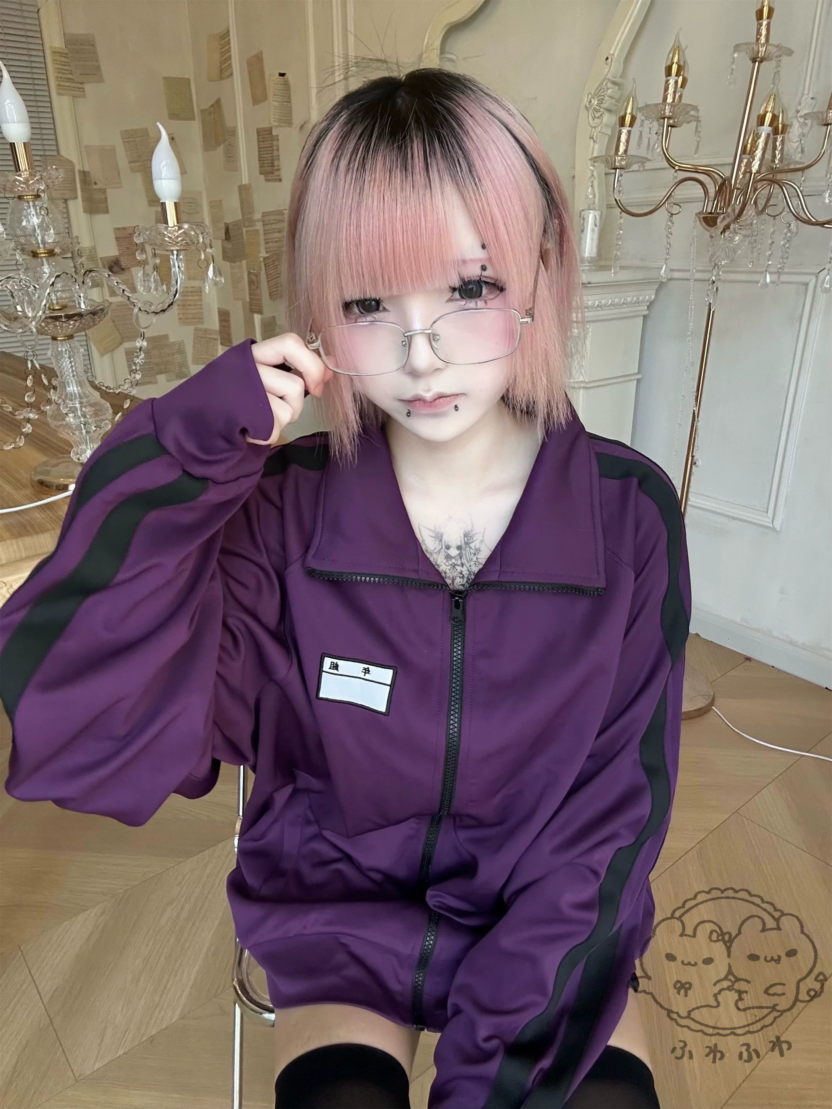 purple jirai kei track jacket worn with black thigh highs vintage room aesthetic close-up
