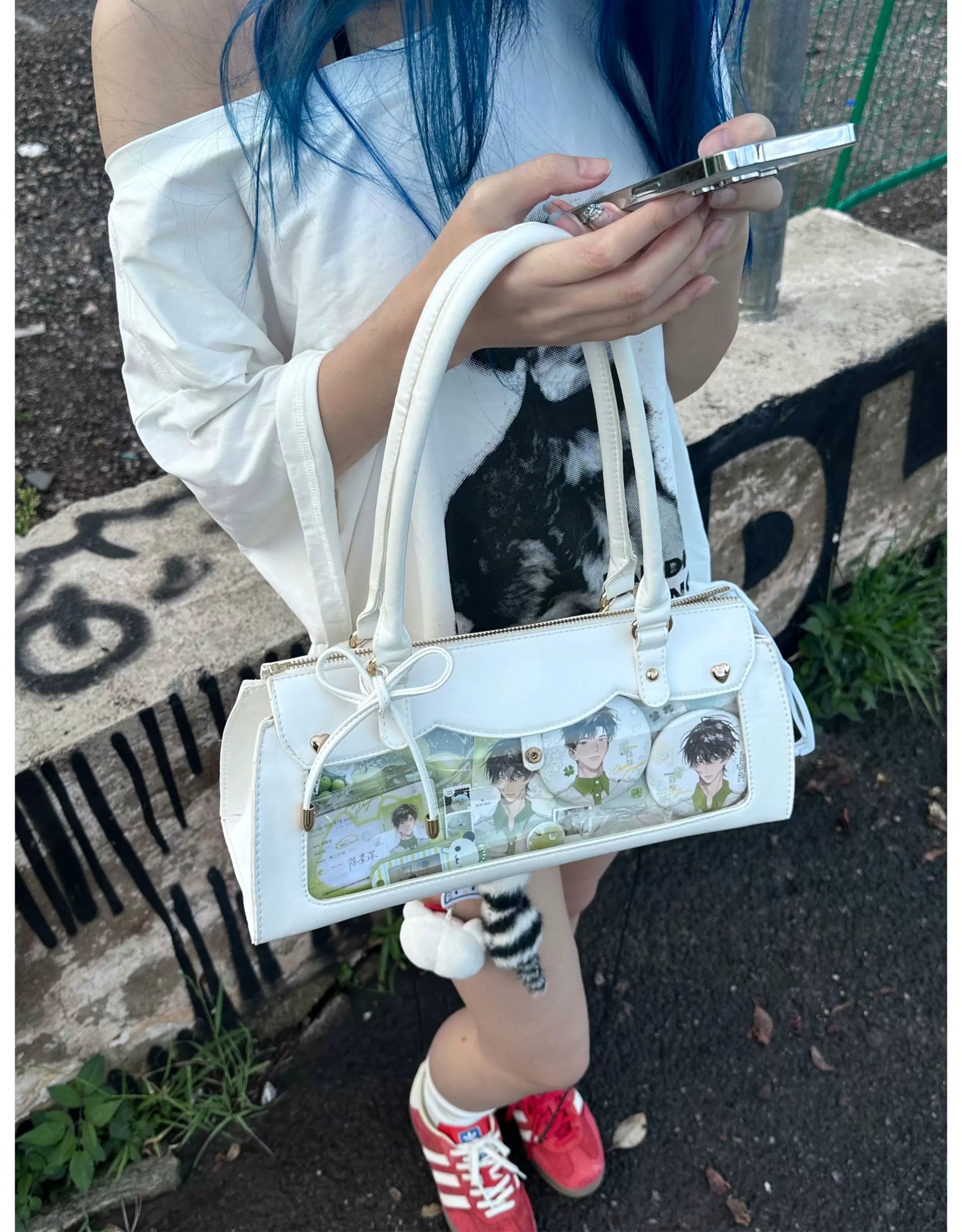 Baguette itabag with adjustable crossbody strap showing multiple wearing styles and carry options