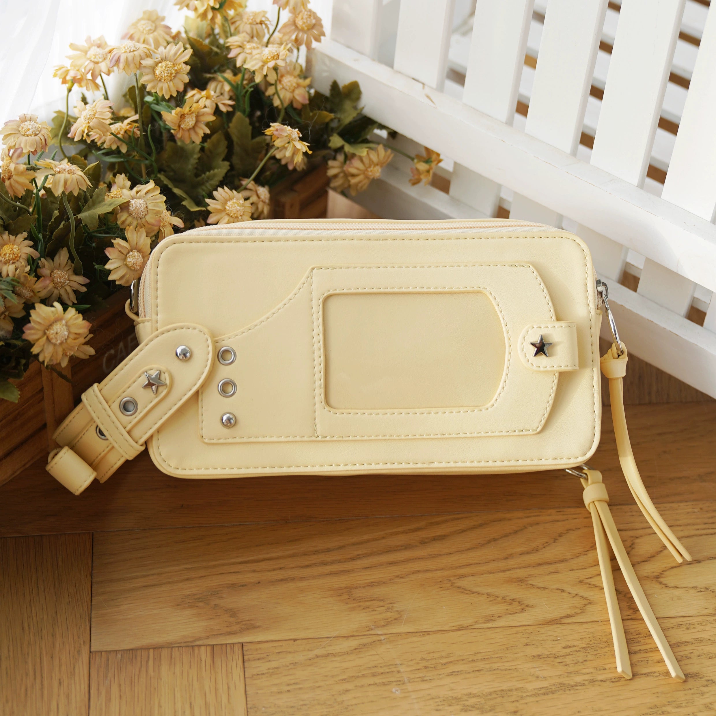 Yellow jirai kei brick itabag with anime collectible display and vibrant colored leather exterior cheerful aesthetic