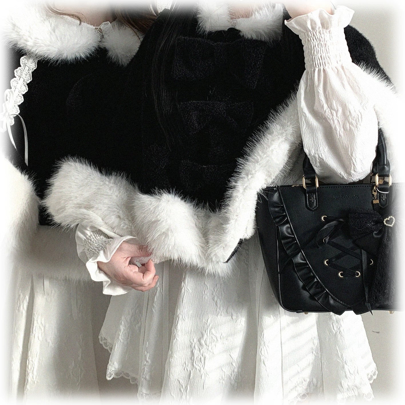 Linen-color cat-ear hooded cape detailed shot emphasizing neutral versatility, fuzzy white trim, and button closure system for seasonal wear