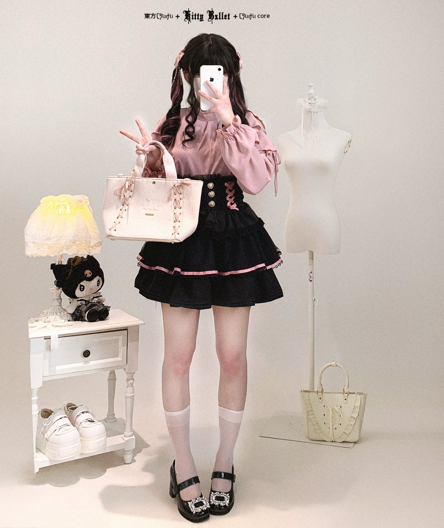 Pink cold-shoulder ruffled blouse Jirai Kei aesthetic paired with black corset skirt white handbag styling