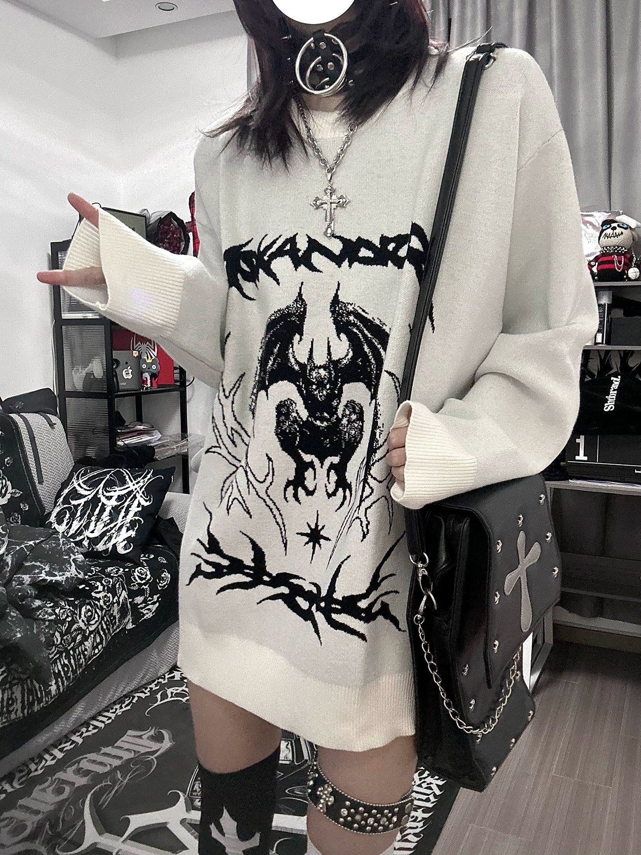 Oversized white bat sweater crew neck neckline detail showing relaxed fit and graphic embroidery placement