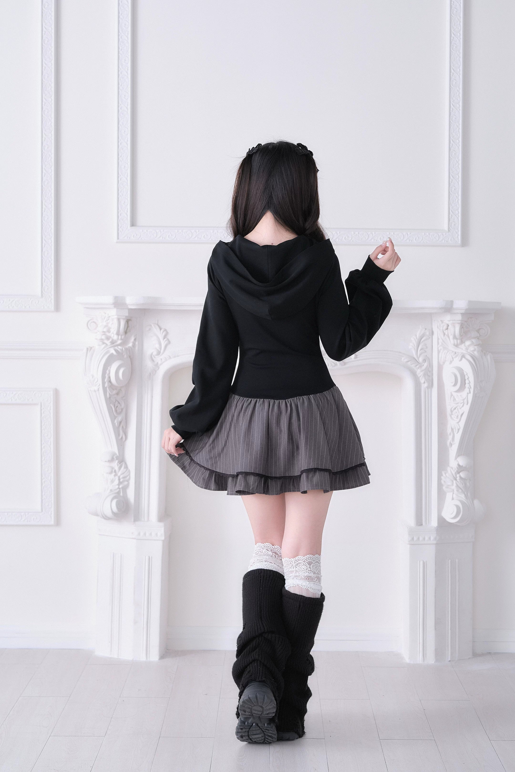 Gray striped Jirai Kei hoodie dress back view showing hooded silhouette and ruffled skirt details, model wearing tall black boots