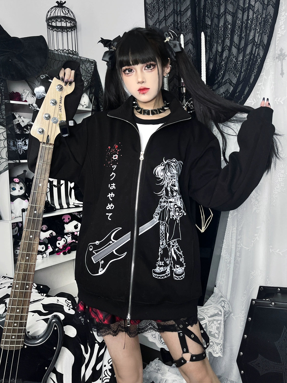 Jirai Kei anime graphic hoodie side-front angle showing loose fit and full zip closure on model with bass guitar