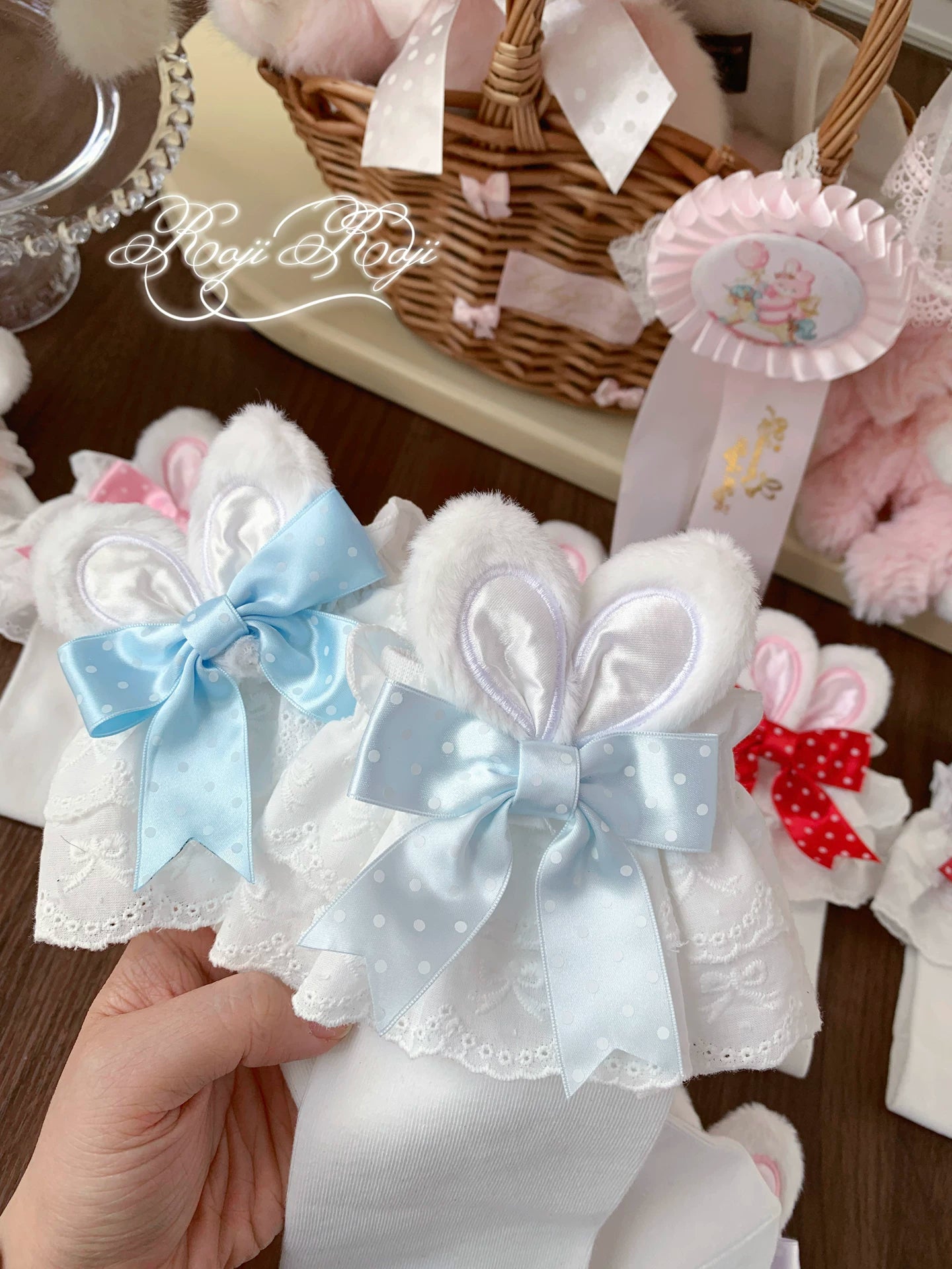 Jirai Kei mid-calf socks with bunny ear trims and polka dot pattern in light purple colorway displayed with Lolita fashion styling