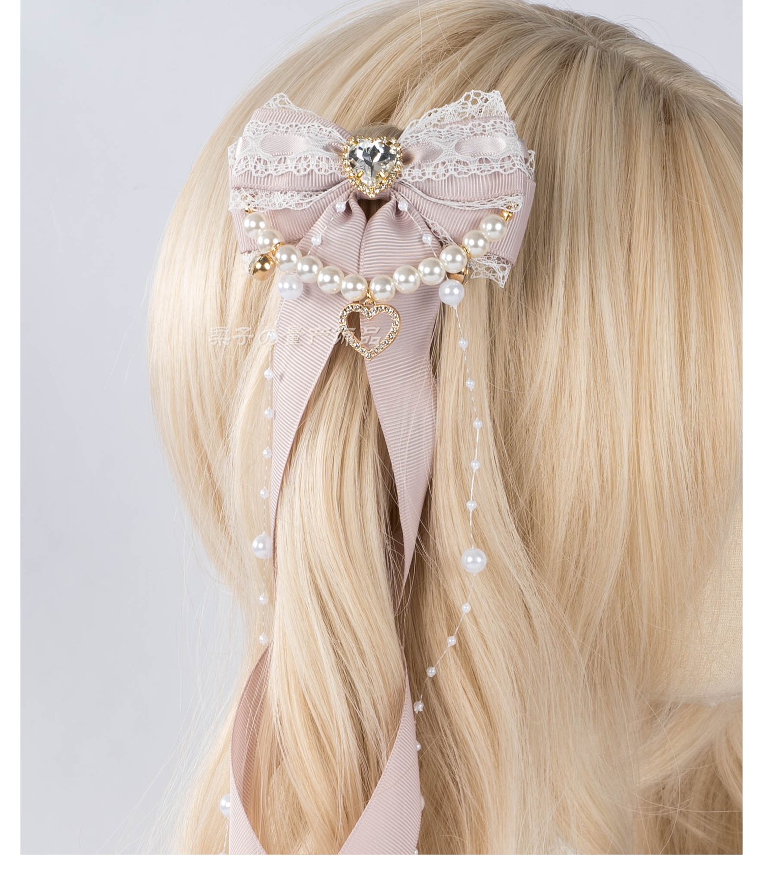 Jirai Kei bow hair clips front facing angle showing heart rhinestone focal point and symmetric ribbon bow design with pearl accents