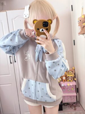 Kawaii star print zip front hoodie bust-up view showing embroidered chest details and star-pattern pocket design on light blue and gray two-tone jacket