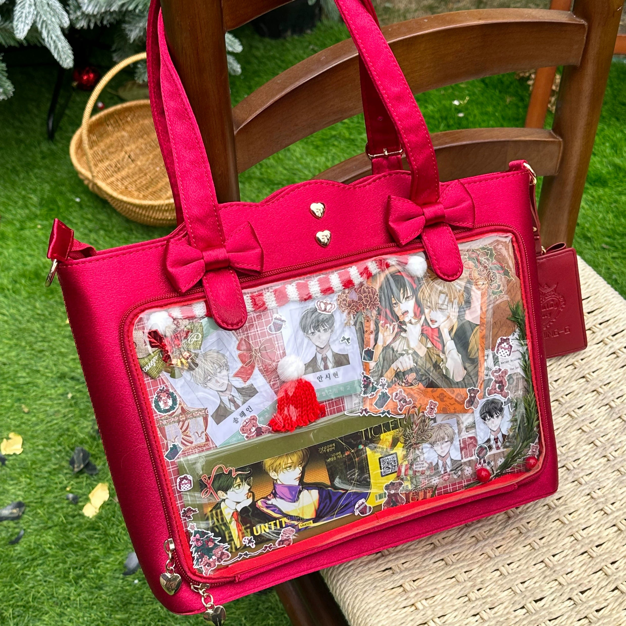 Red Jirai Kei ita bag featuring wavy edge silhouette design, prominent bow-decorated straps, clear anime character pin display panel, heart metal studs, and dual carrying methods for versatile styling