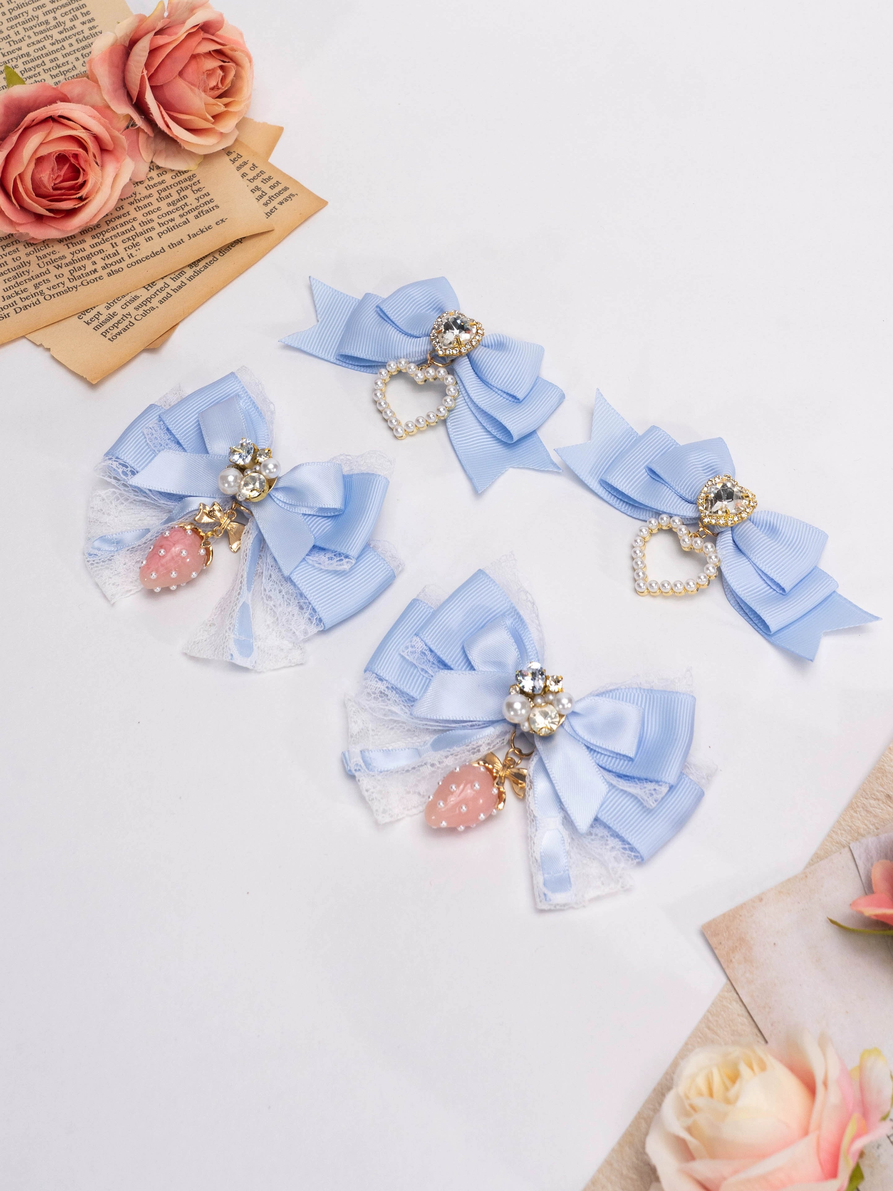 Mixed dusty blue Jirai Kei lolita bow hair clips with lace strawberry charm and rhinestone heart decor