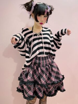 Pink-black plaid Jirai Kei ruffle mini skirt full-body outfit, layered ruffles with elastic waist, styled with twin buns and fishnet stockings
