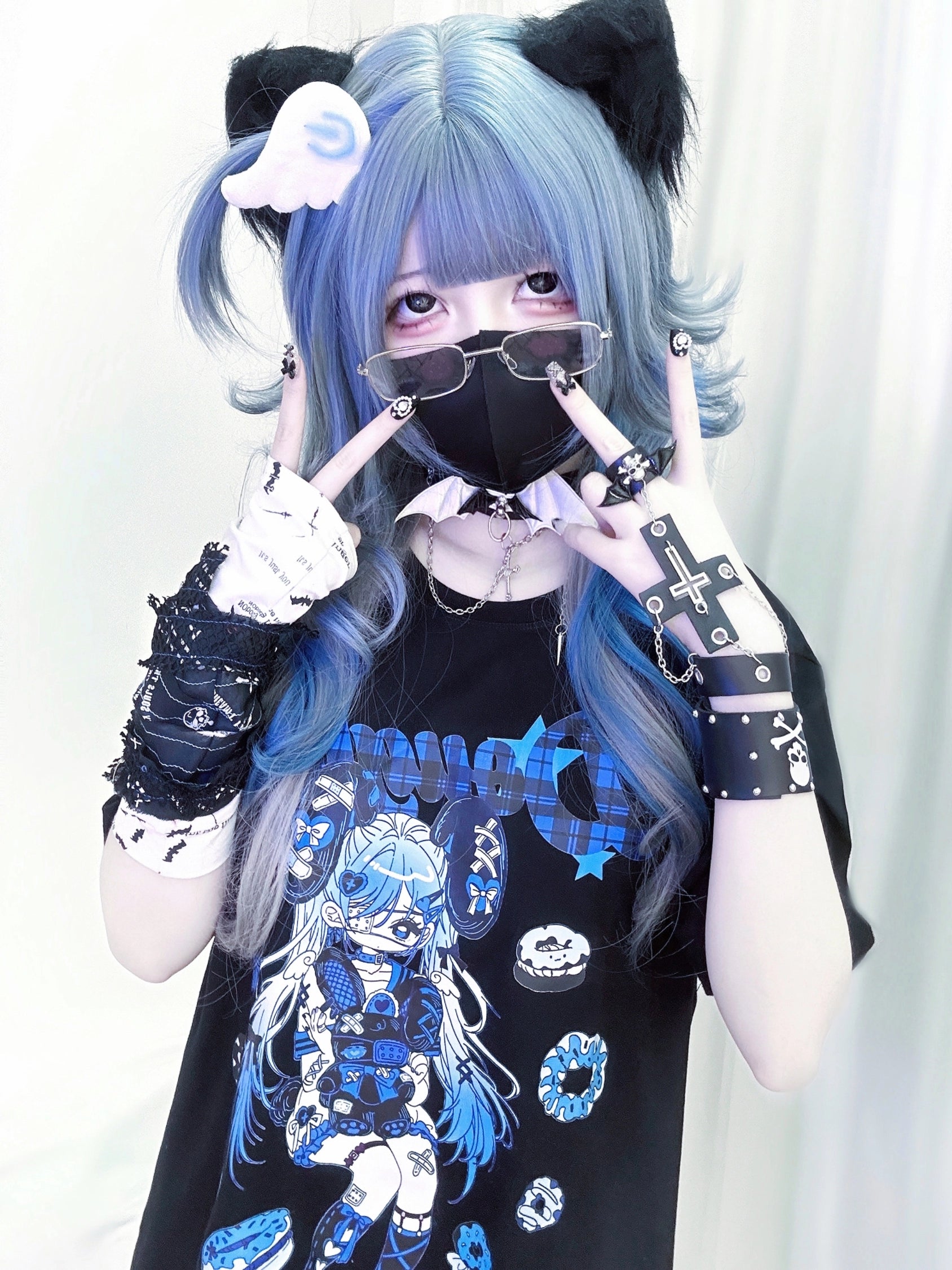 Jirai Kei anime punk T-shirt lifestyle flat lay composition showing garment with all three color variants blue black pink red arranged for color option comparison