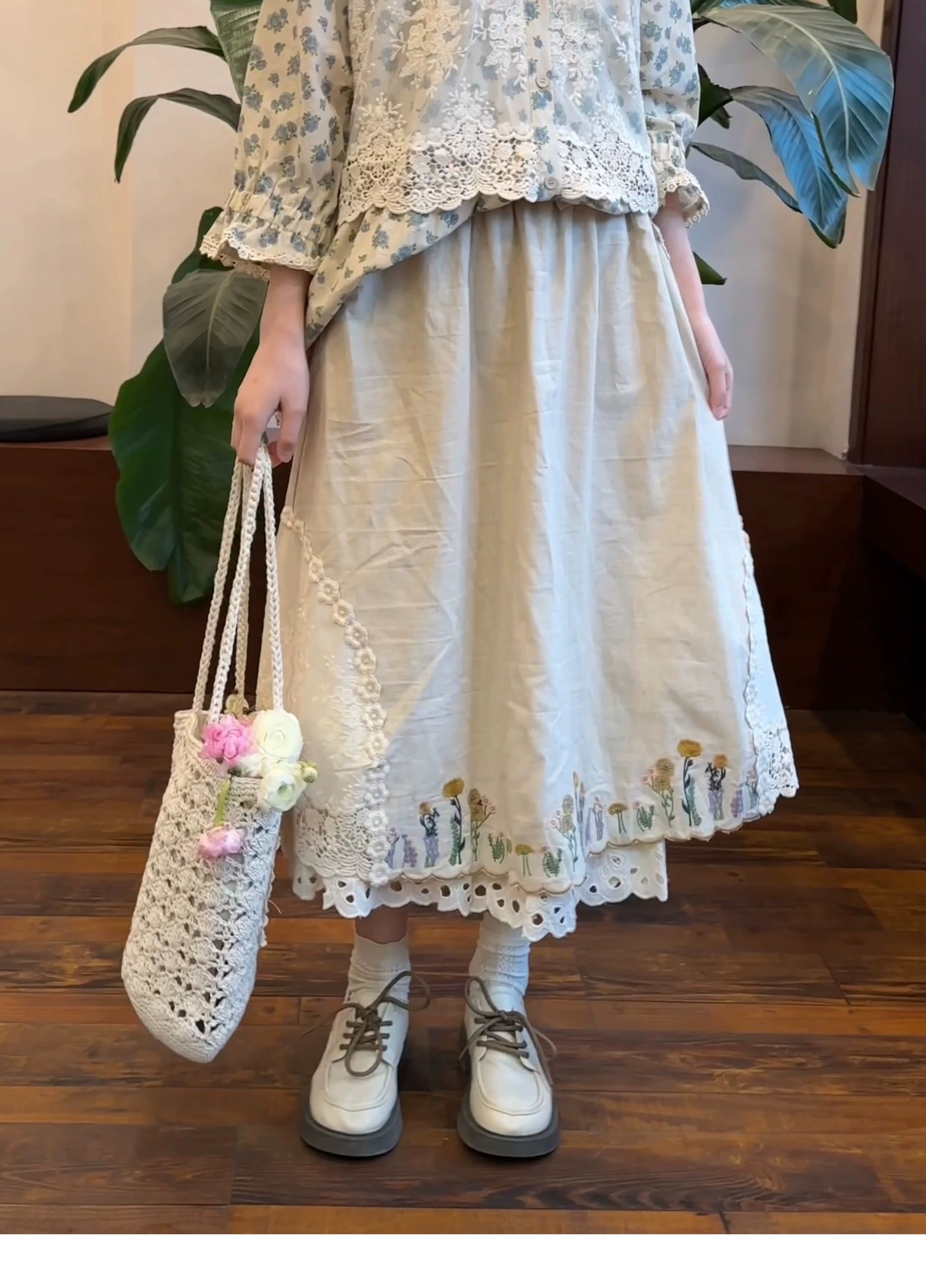 Mori style embroidered long skirt off-white with floral embroidery lace hem woven flower tote front lower body view