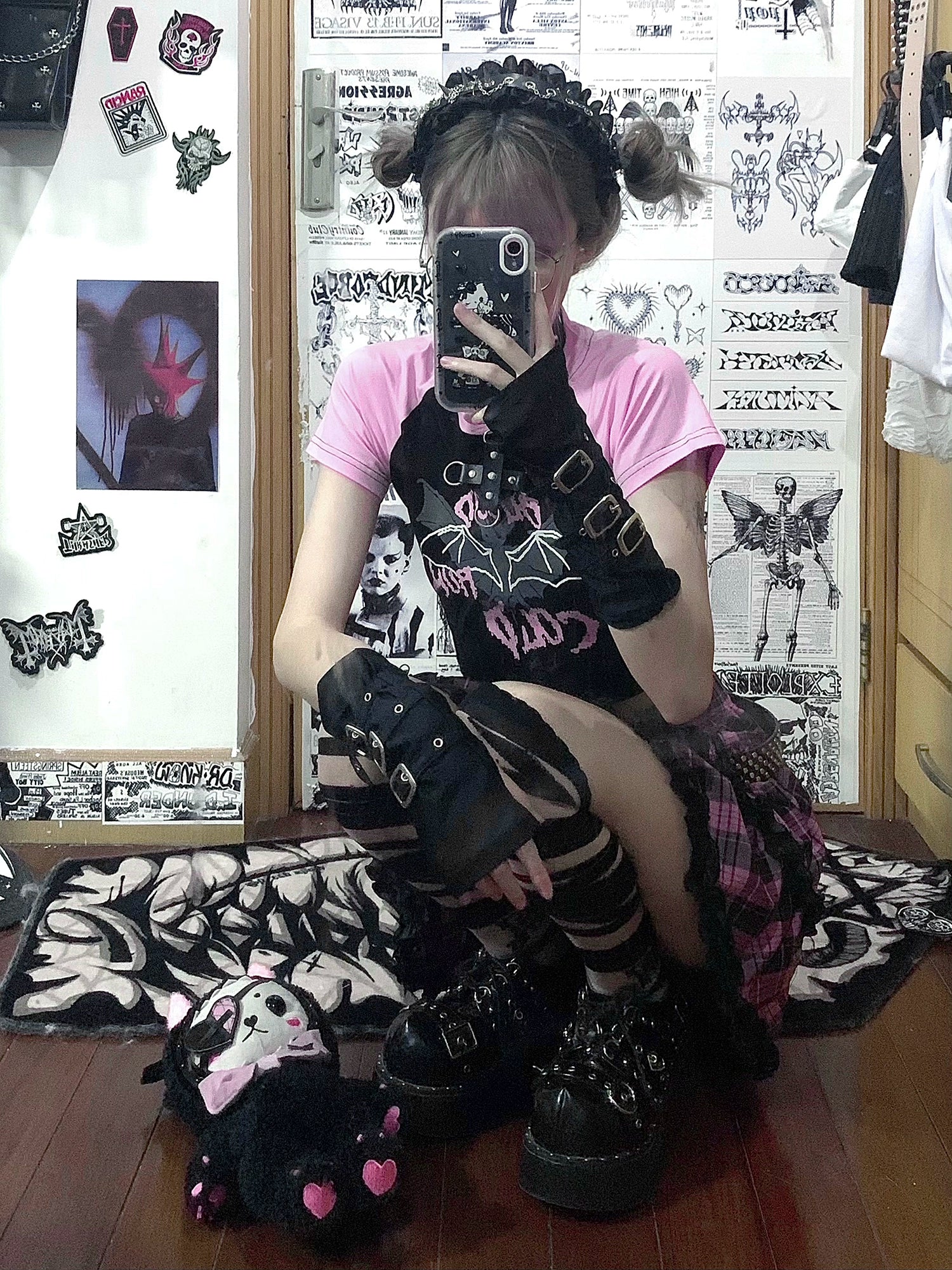 Pink-black plaid Jirai Kei mini ruffle skirt sitting close-up, punk aesthetic with pink crop top, fishnet stockings, and platform footwear