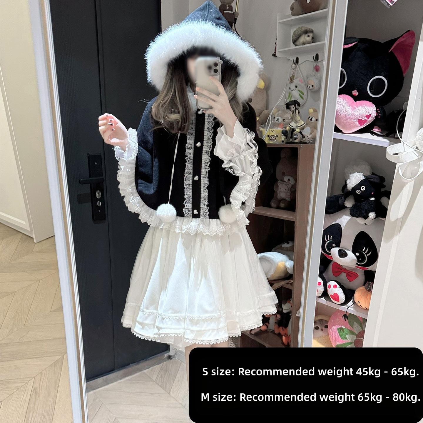 Contrast black and white Jirai Kei ensemble with pom-pom trims, black velvet bodice, tiered white mini skirt, fuzzy fur hood