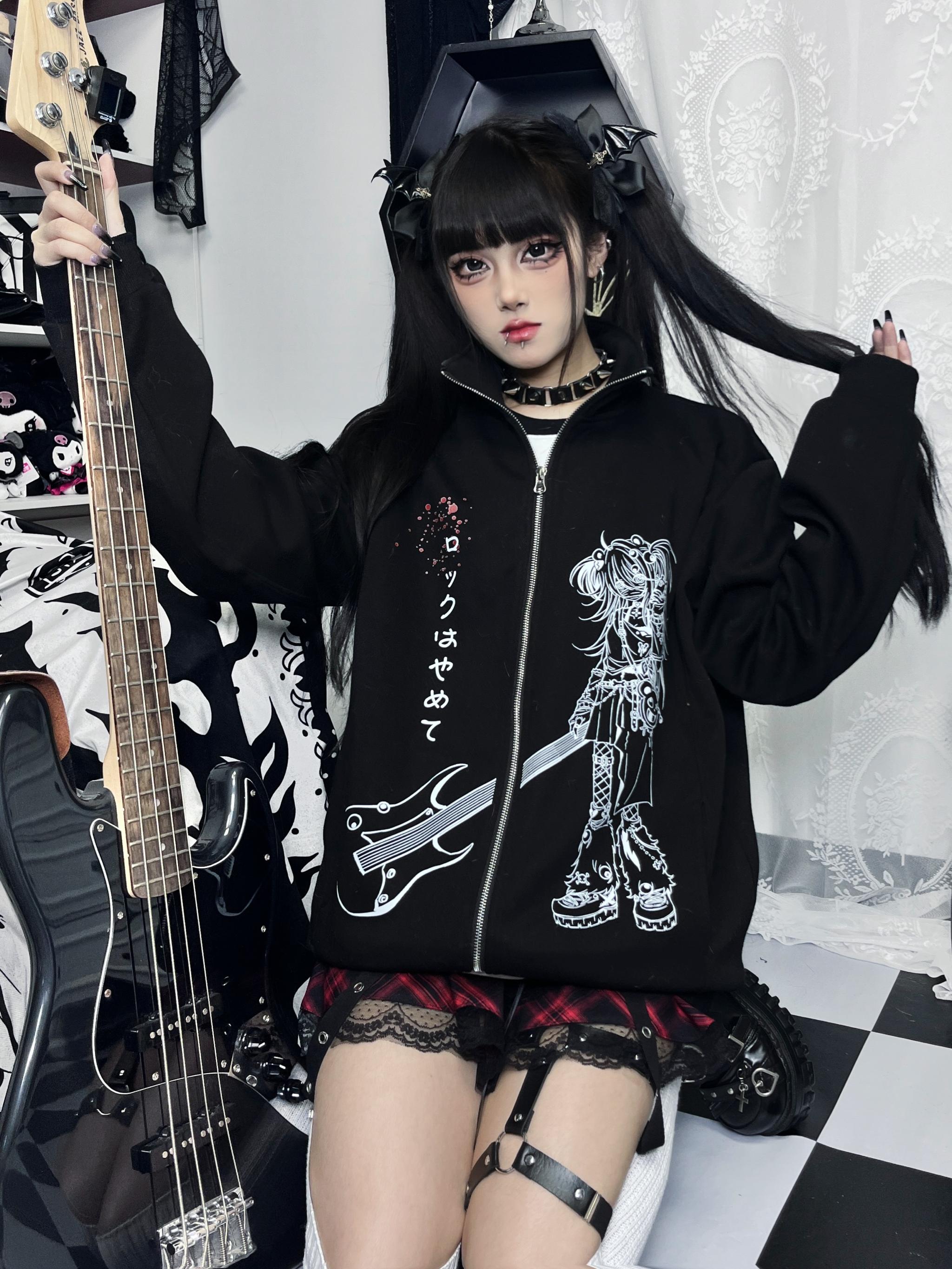 Oversized Jirai Kei hoodie three-quarter front shot on model wearing plaid mini skirt and leg garter styled with rock aesthetic