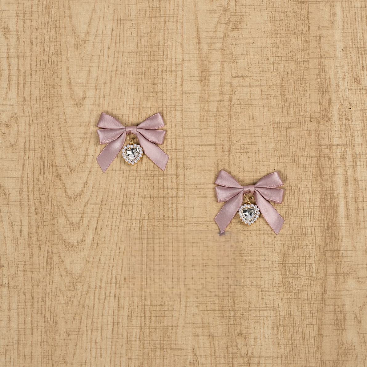 Dusty pink Jirai Kei bow hair clips with rhinestone pendant charms vintage aesthetic styling product photography