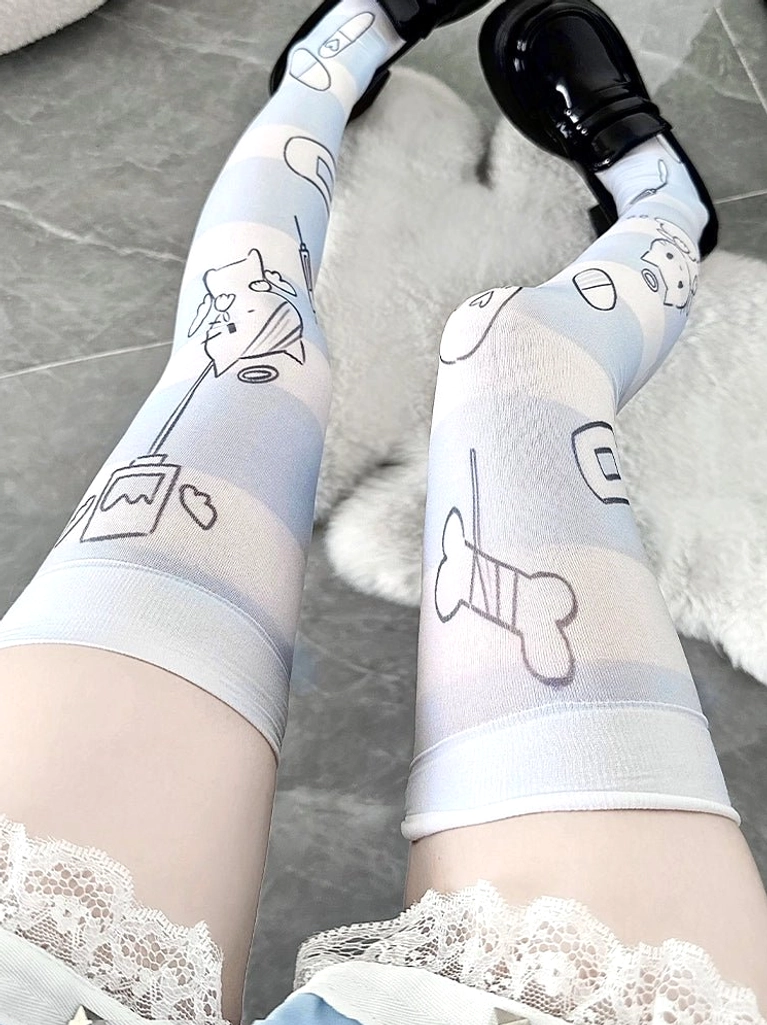 Printed Tenshi angel thigh-high socks with elastic thigh strap, pale blue base featuring bone and animal line art prints, low overhead front view with loafers