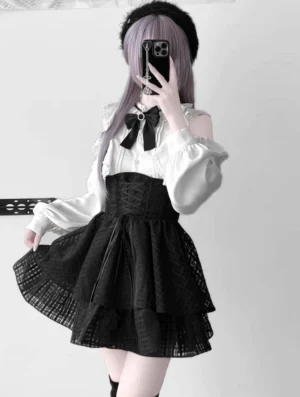 Apricot off-shoulder lace blouse with ruffles and detachable rhinestone bow tie paired with black tiered tulle skirt - front mirror selfie jirai kei two-piece outfit