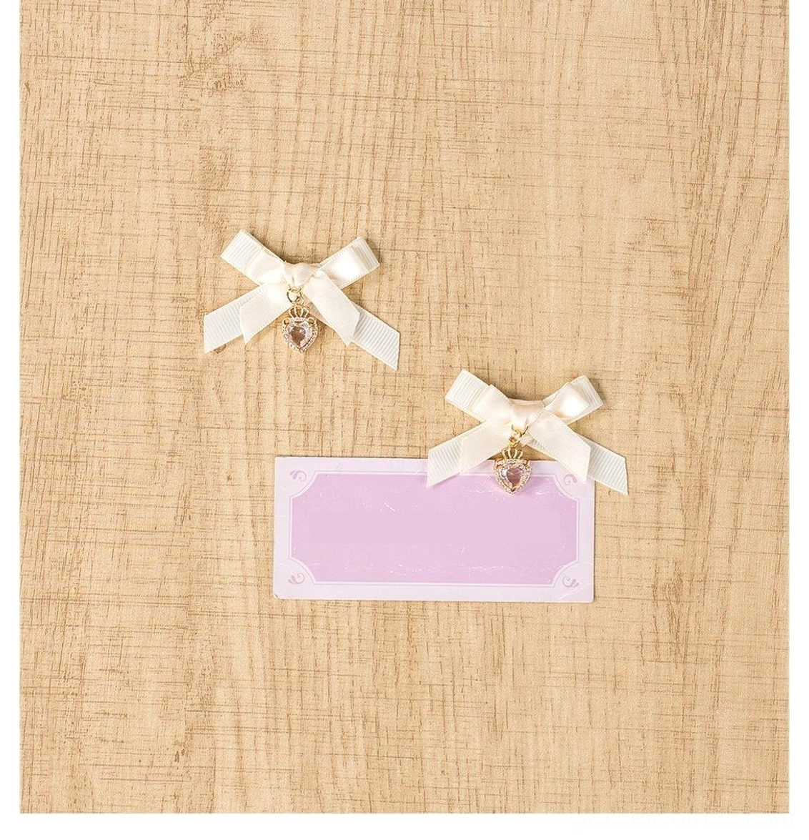 Apricot mini bow hair clips pair showing double-layered bow design with sparkling heart-shaped rhinestone