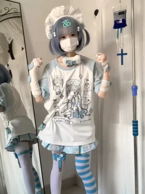 Aqua blue and white tenshi nurse raglan t-shirt front view modeled by cosplayer in full-body mirror shot showing cartoon nurse graphic and oversized fit