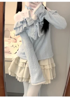 Close-up mirror selfie of Azure bunny Jirai Kei outfit featuring off-shoulder frill collar, beige layered underskirt, and detachable pom-pom bow detail in bedroom setting