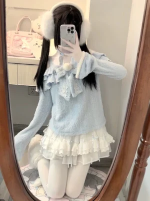 Azure bunny Tenshi Kawai sweater tiered skirt set worn by model with twin tails in full-length mirror selfie, showcasing off-shoulder fuzzy top and ruffled white tiered mini skirt with lace trim