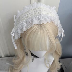 White lace ruffled Gothic Lolita headband with heart embellishments and satin side ribbons, front close-up view on blonde twin-tail mannequin