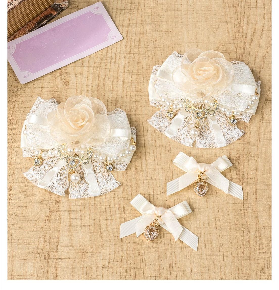 Apricot rose hair clip detailed view showing tulle rose construction lace bow and pearl chain embellishments