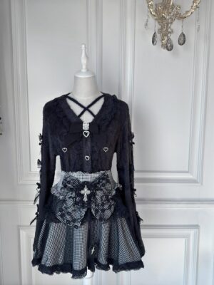 Jirai Kei plaid tulle skirt with removable cross bow brooch and fuzzy black cardigan displayed on mannequin gothic sweet aesthetic
