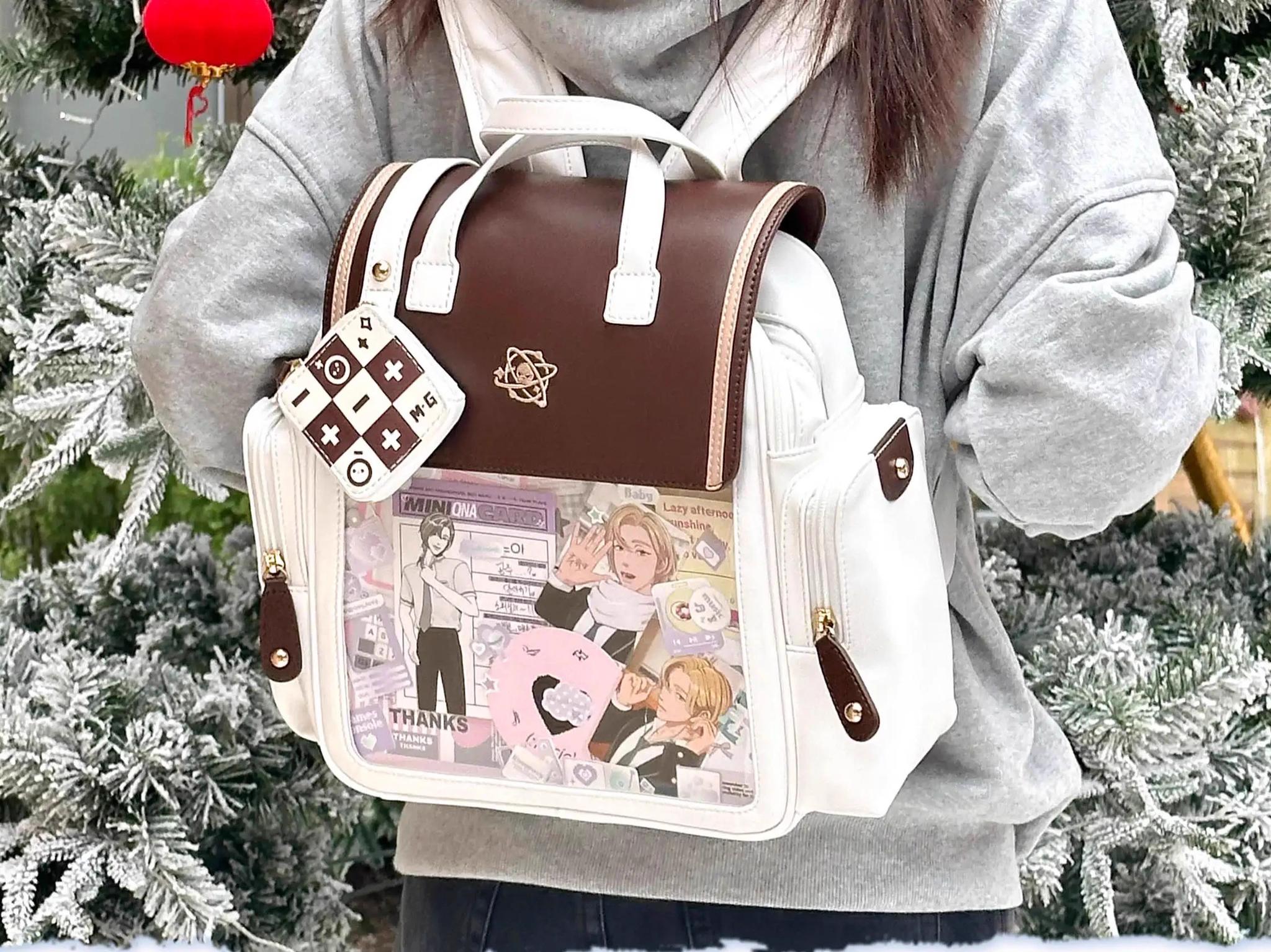 Kawaii Jirai Kei itabag backpack detail showing embroidered flap logo and premium stitching construction